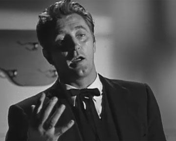 "Love/Hate" - Le Révérend Harry Powell (Robert Mitchum) raconte aux enfants l'histoire de "la main gauche et la main droite". 